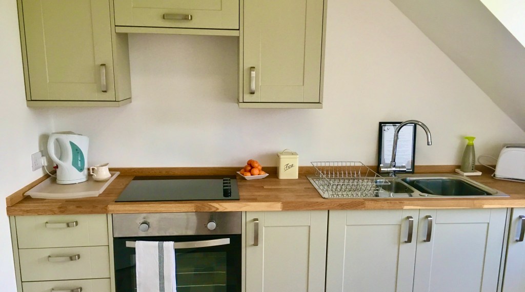 Fully fitted compact kitchen.
